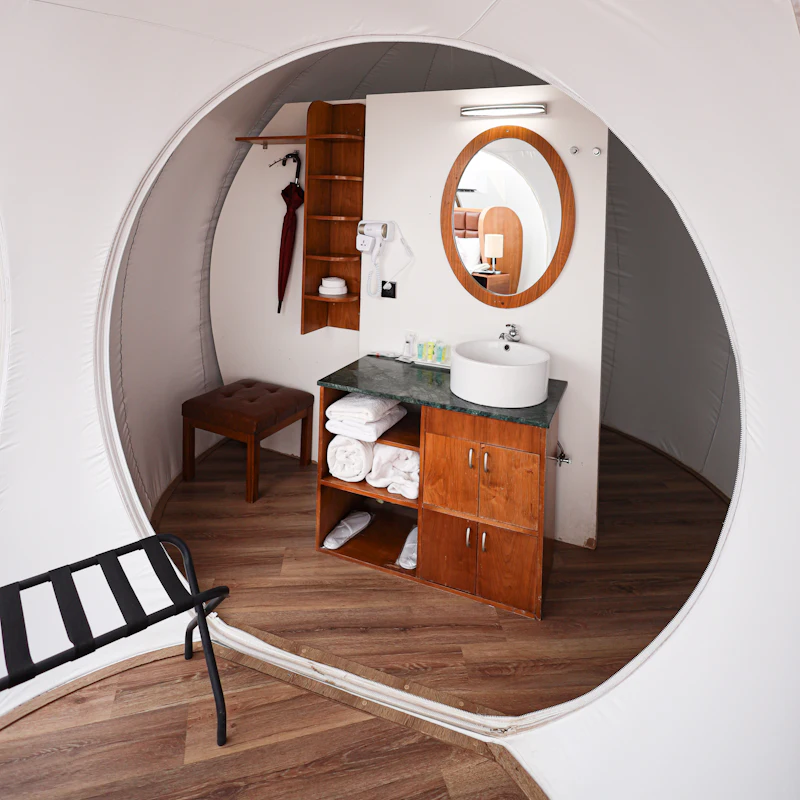A bathroom vanity with an arched doorway